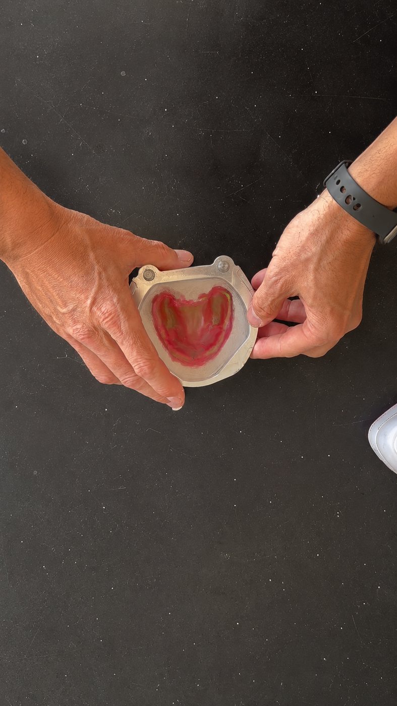 Hands seating the mid flask section onto the flask base